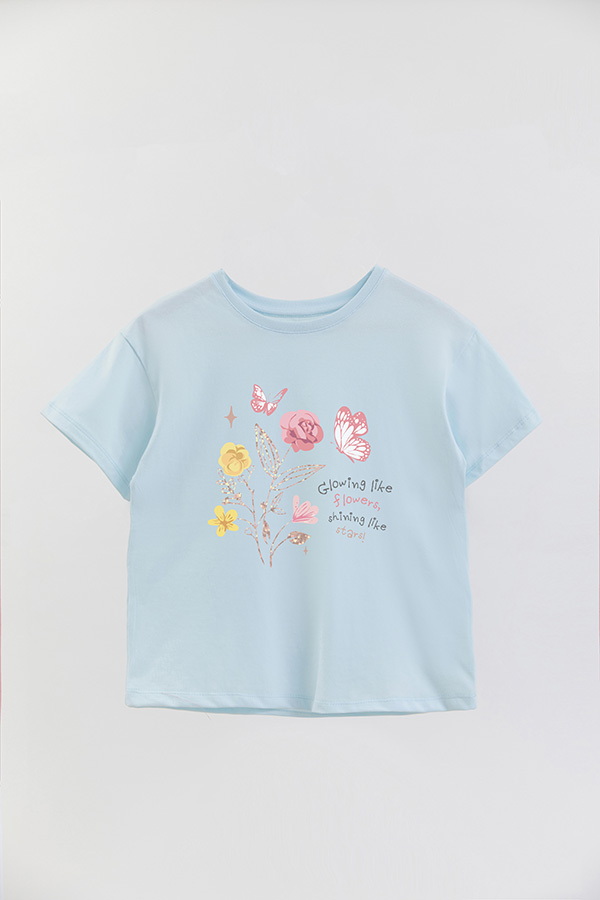REMERA GIRL OVER GLOWING LIKE FLOWERS