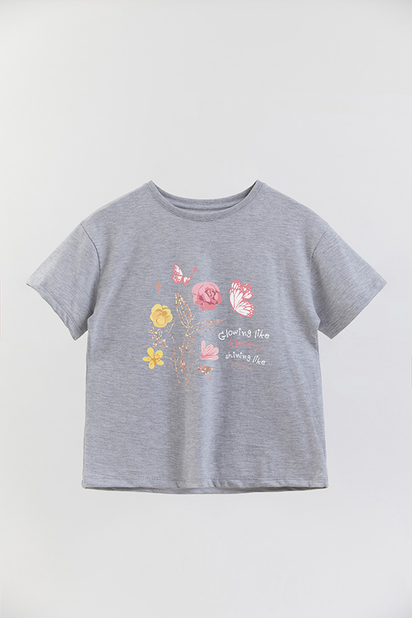 REMERA GIRL OVER GLOWING LIKE FLOWERS