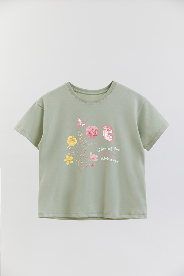 REMERA GIRL OVER GLOWING LIKE FLOWERS