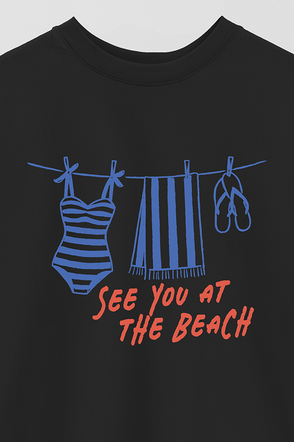 REMERA OVER ESTAMPADA SEE YOU AT THE BEACH