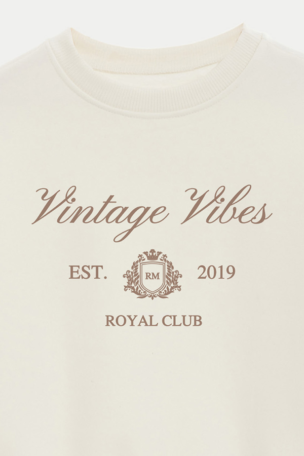BUZO CROP ESTAMPADO VARSITY VINTAGE VIBES