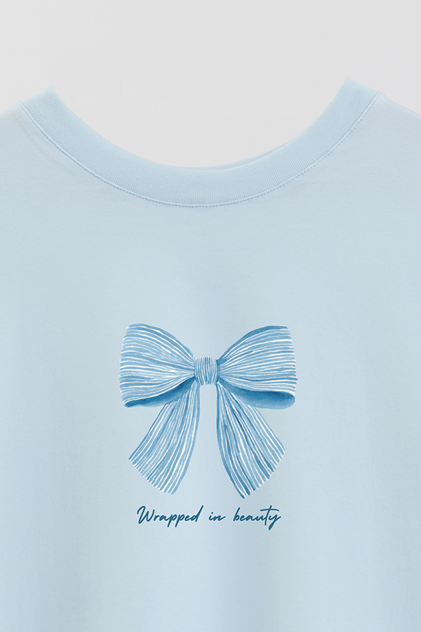 REMERA CROP ESTAMPADA COASTAL WRAPPED IN BEAUTY