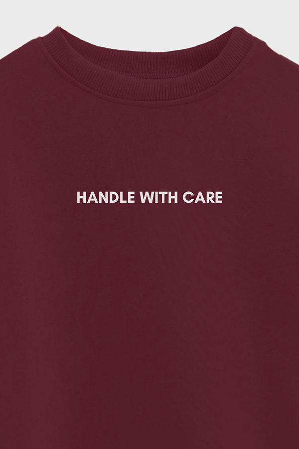 BUZO CROP ESTAMPADO MNM HANDLE WITH CARE