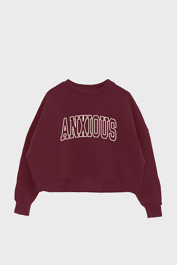 BUZO CROP ESTAMPADO VARSITY ANXIOUS