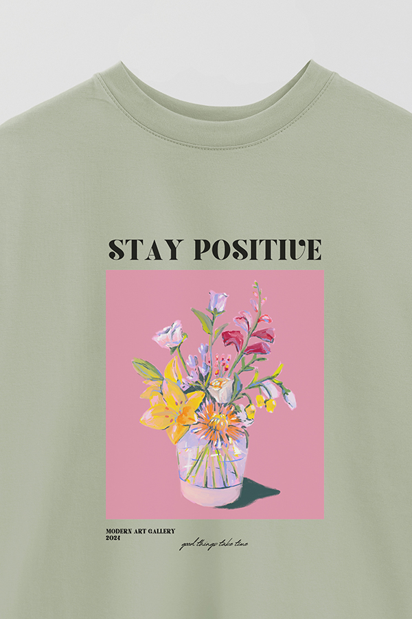 REMERA OVER ESTAMPADA GRAPHIC STAY POSITIVE