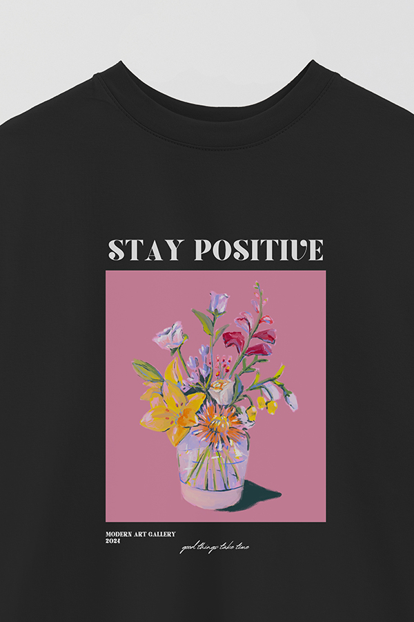REMERA OVER ESTAMPADA GRAPHIC STAY POSITIVE